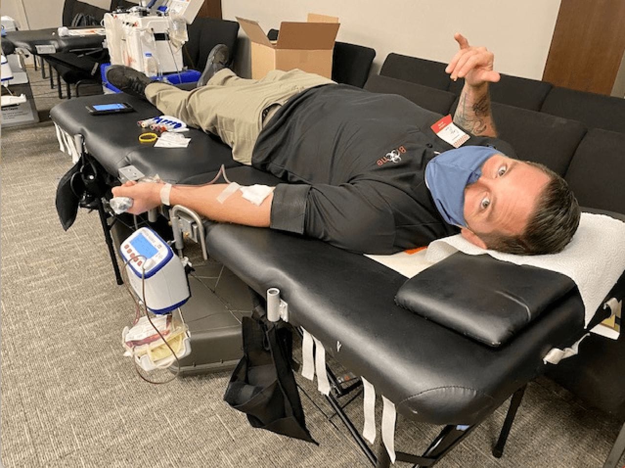 Cory Flores, Bio-One Owner, donating blood in Orange County